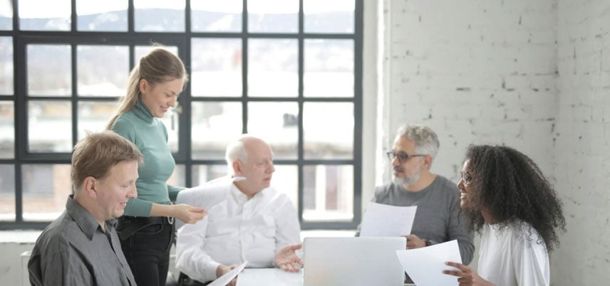 Members of the team working around a table